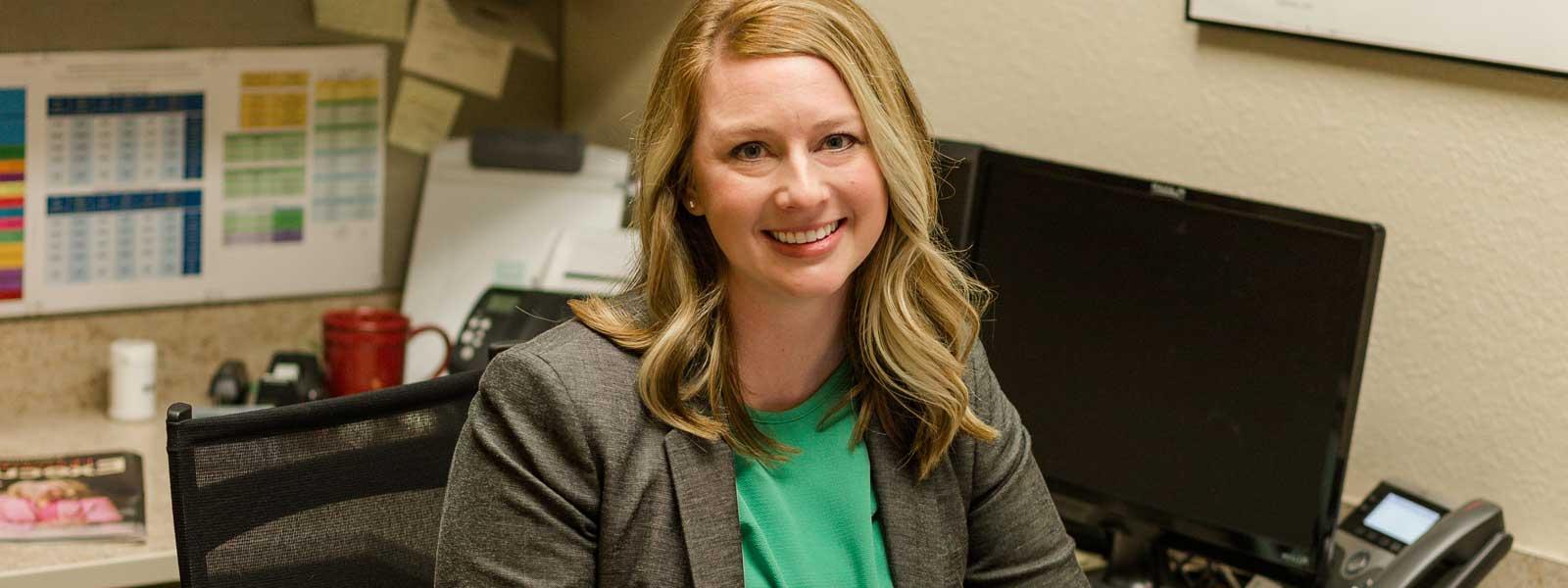 Female businessperson sitting at desk